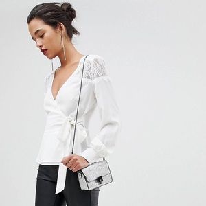 Ruffle detail lace insert wrap blouse